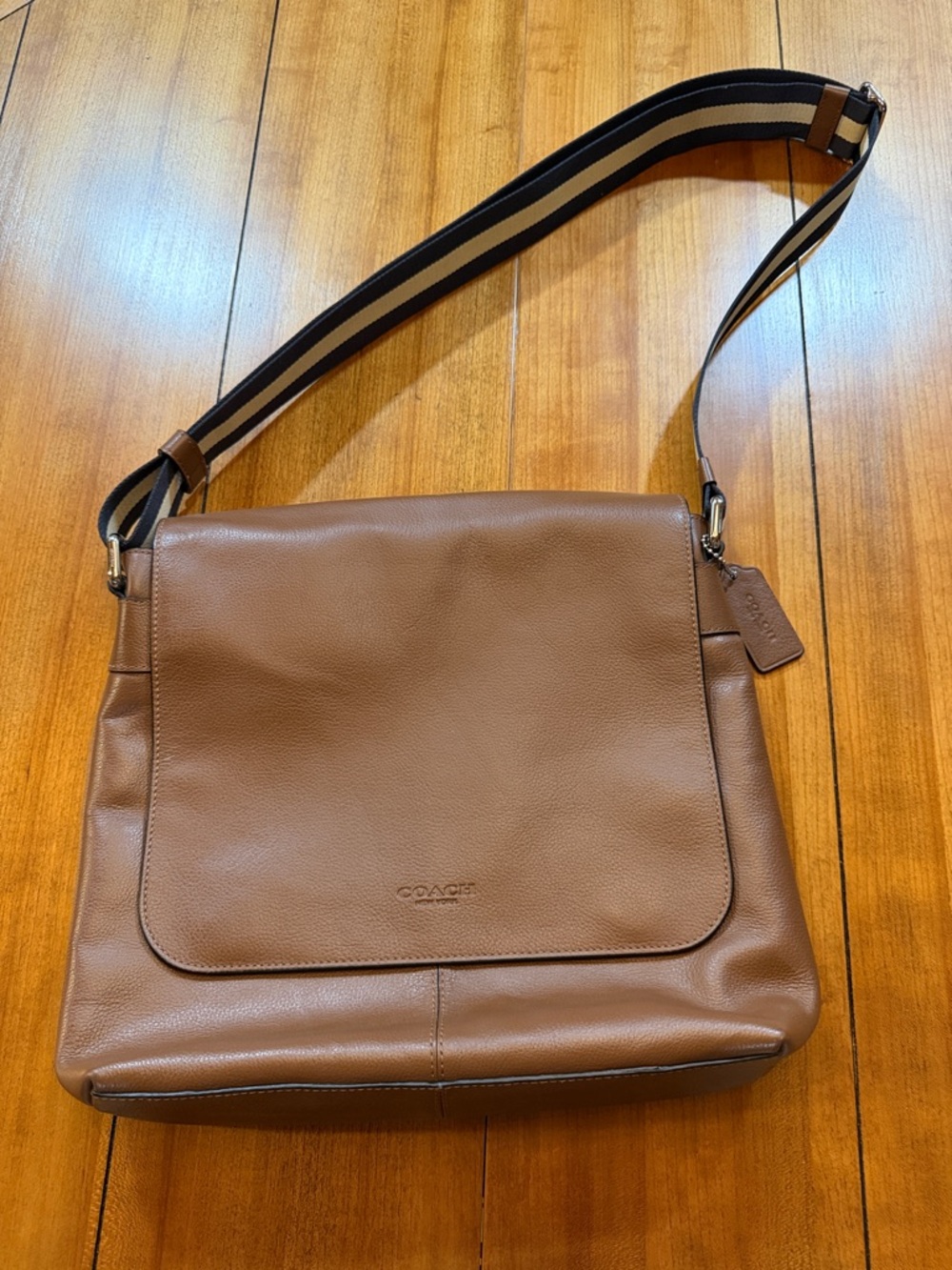 Coach Men’s Tan Leather Messenger Bag with Striped Webbing Strap